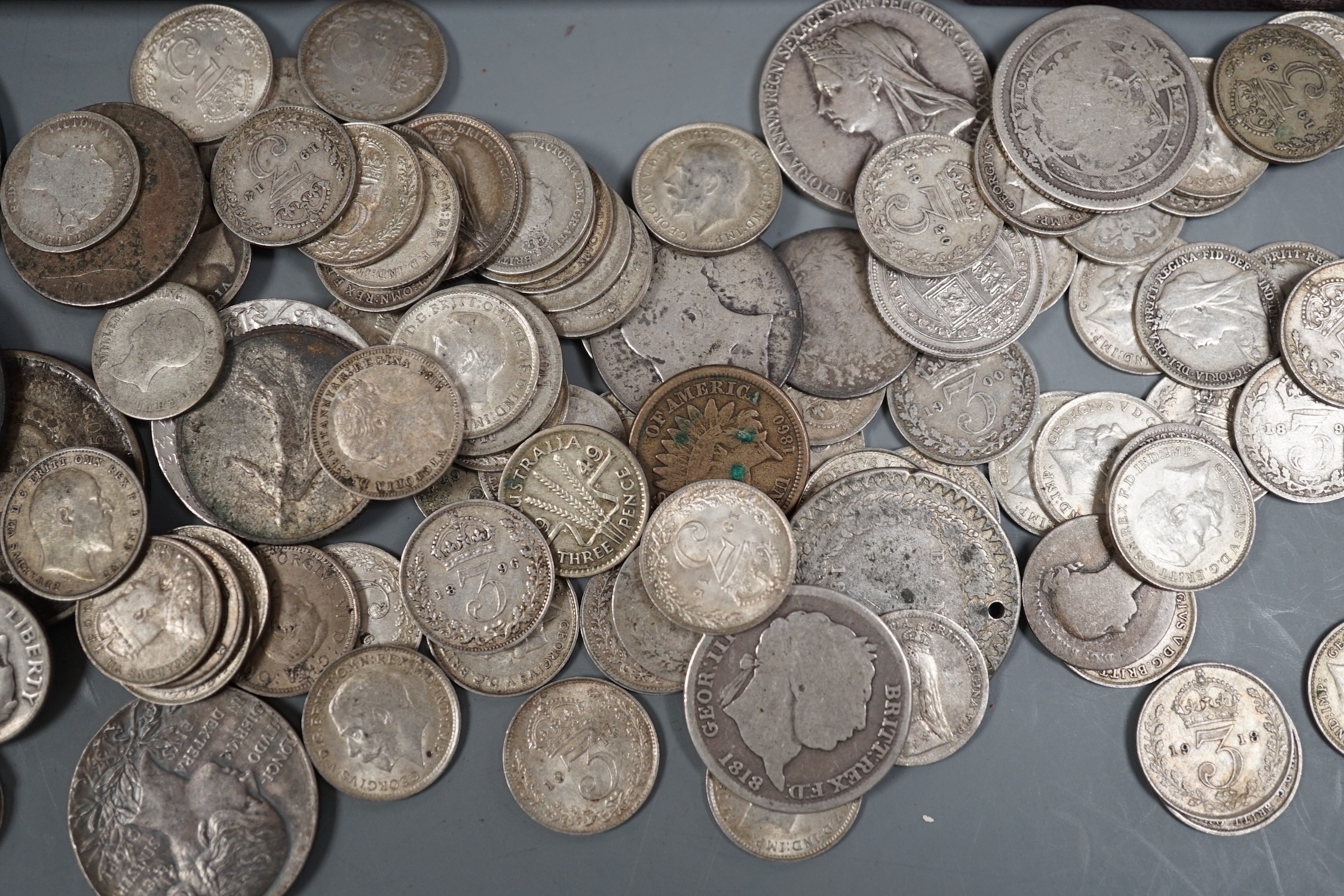 A collection of silver threepences and minor coins